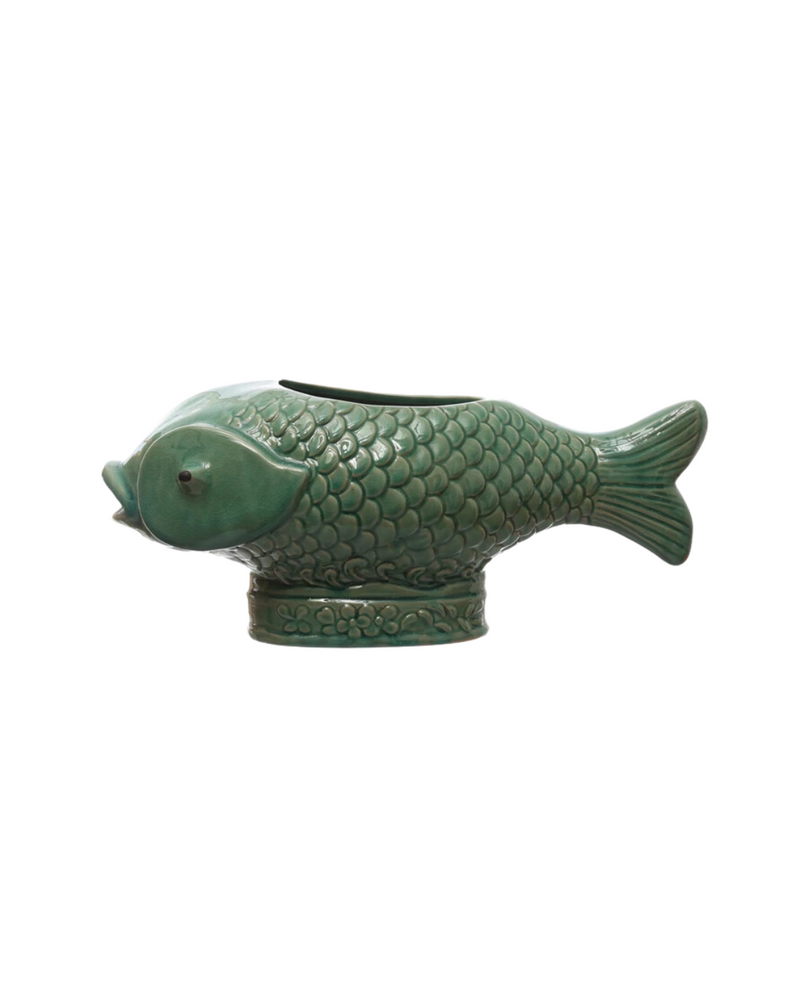 A green ceramic vase shaped like a fish, featuring intricate scale detailing and a lifelike design, displayed against a white background.