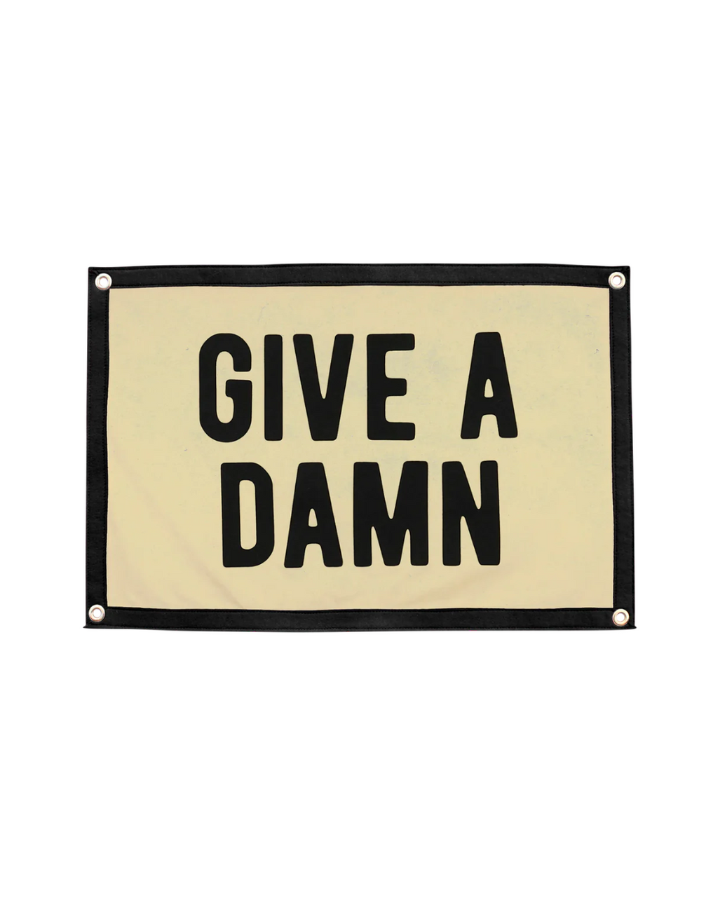 A rectangular flag with the phrase "GIVE A DAMN" printed in bold, black letters on a beige background. The flag has a black border with metal grommets in each corner for hanging.