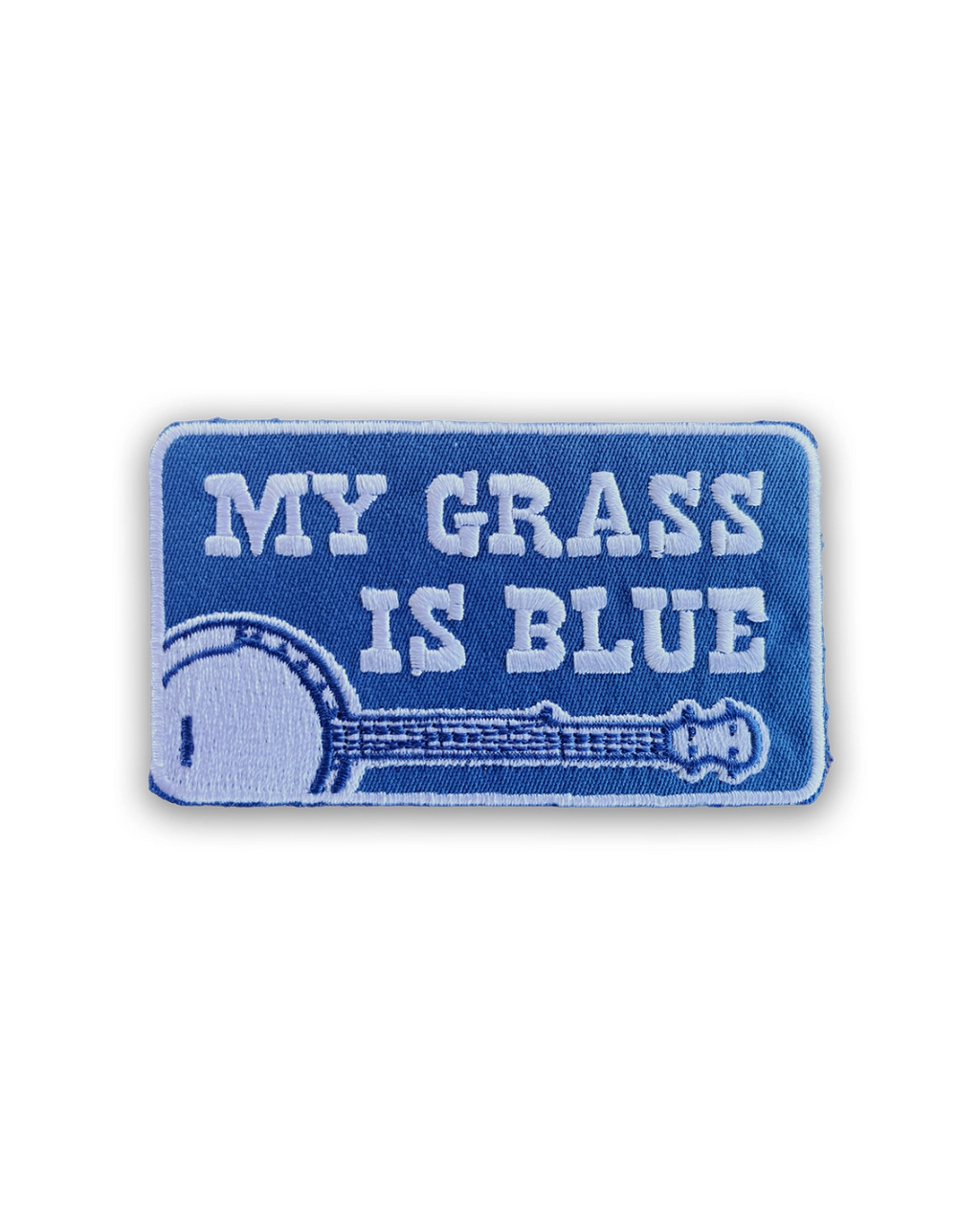 A rectangular blue patch featuring the phrase 'MY GRASS IS BLUE' in raised white letters, with an embroidered banjo design.