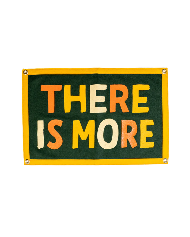 Premium wool felt, bold green with cream, gold, and orange  banner with the phrase "There is More". 