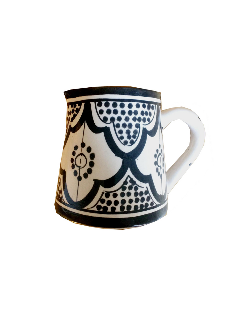 A traditional Moroccan Safi milk pitcher in black and white, featuring intricate hand-painted designs and a sturdy handle.