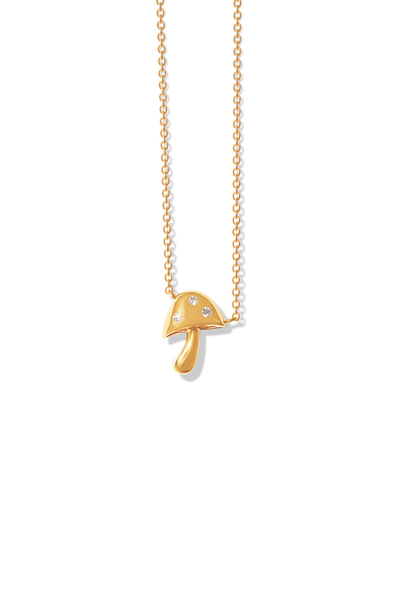 A delicate 14k gold necklace featuring a mushroom pendant encrusted with three small diamonds. 