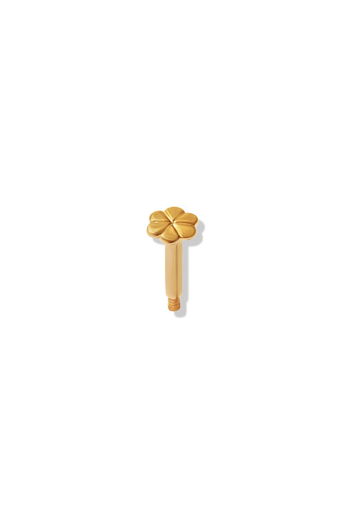 A small yellow gold flat back in the shape of a flower. 