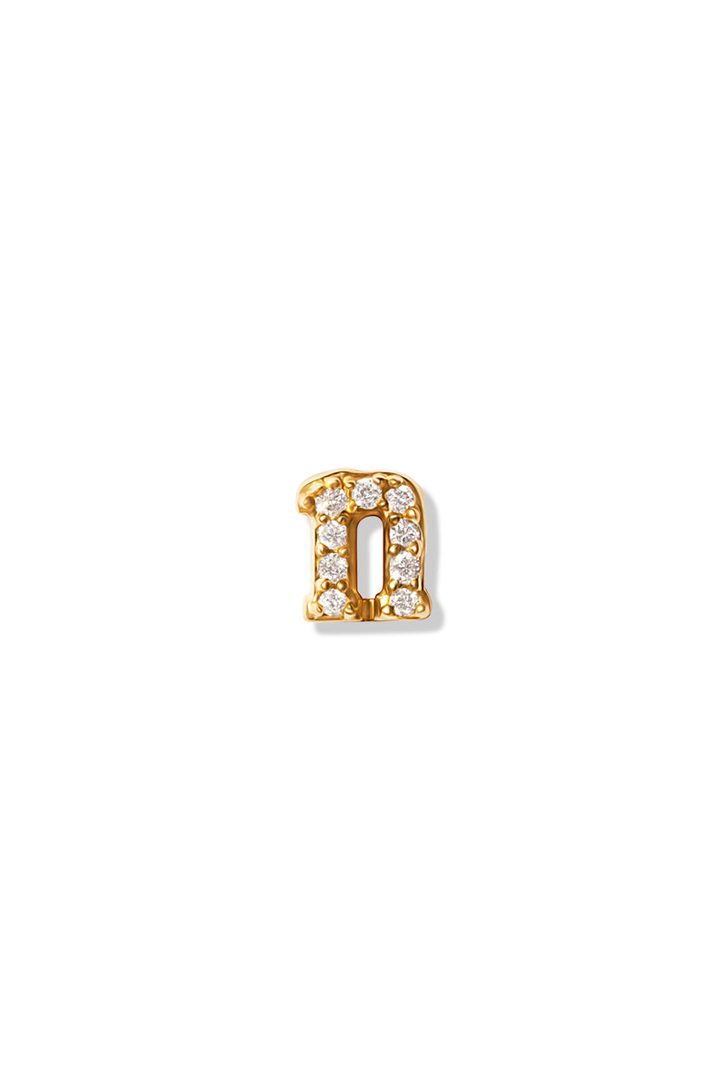 A small 14K yellow gold stud earring in the shape of the letter "n", encrusted with diamonds.