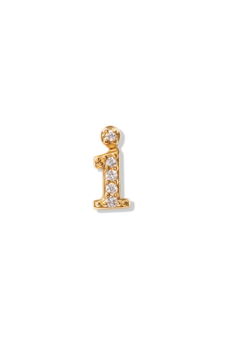 A small 14K yellow gold stud earring in the shape of the letter "i", encrusted with diamonds.