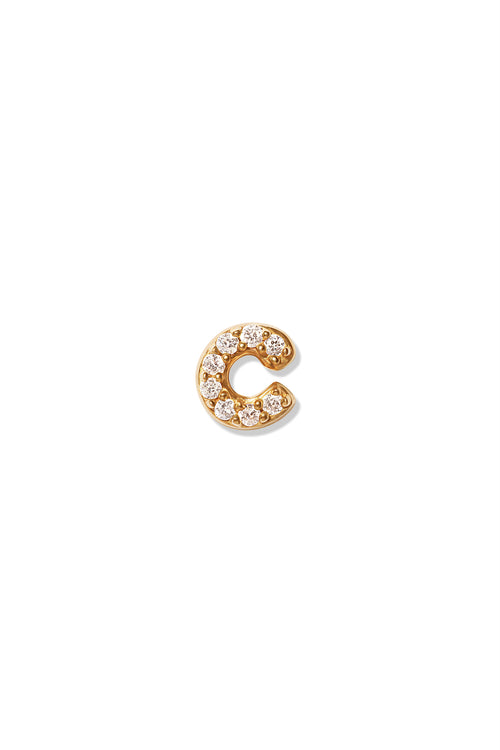 A small 14K yellow gold stud earring in the shape of the letter "c", encrusted with diamonds.